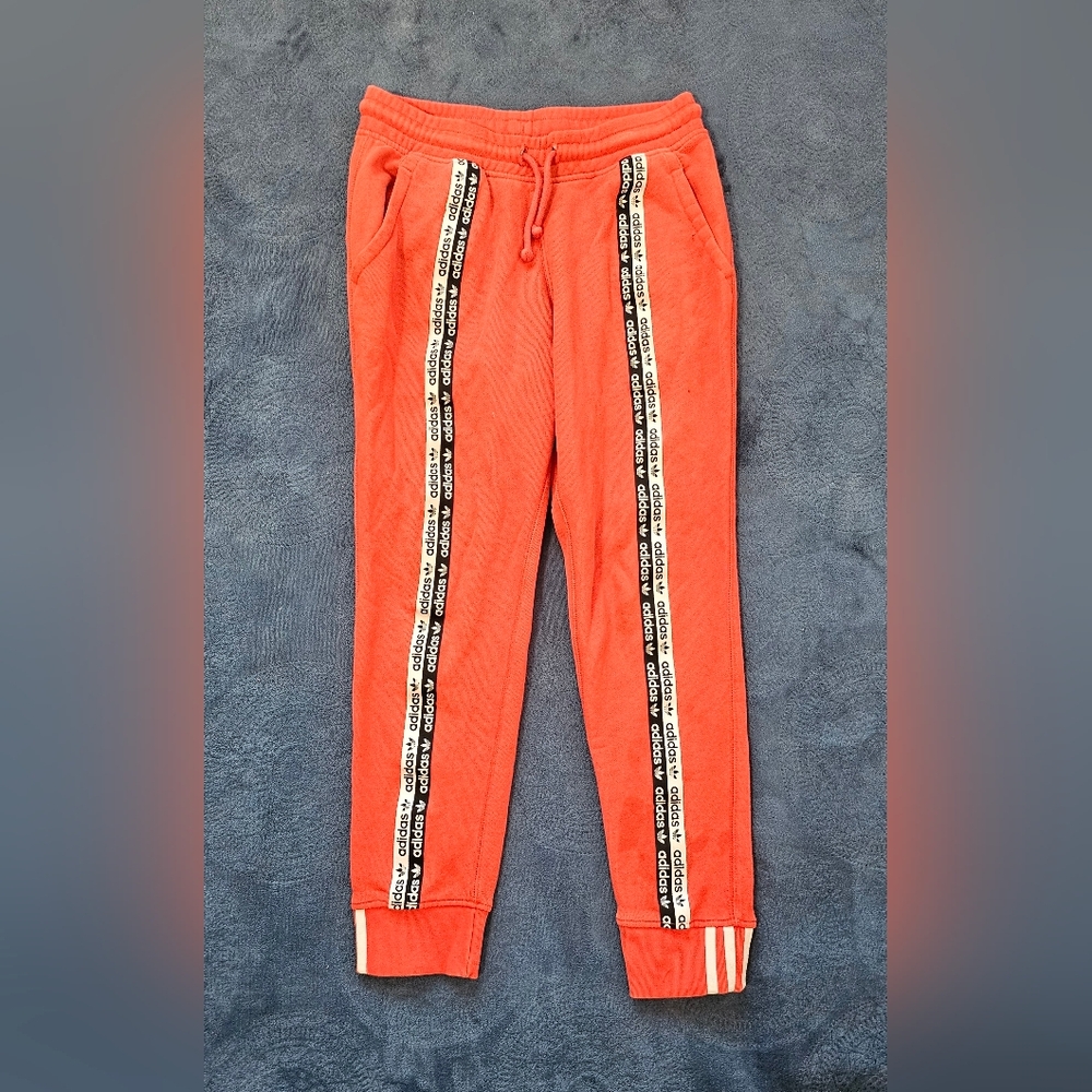 Women's size small, Adidas red sweatpants, used in fair condition